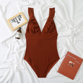 Traje de baño de una pieza con cuello en V liso, volantes, cordones y espalda descubierta